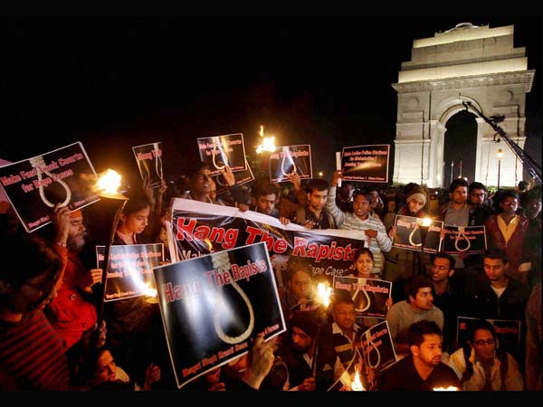 03-people-shout-slogans-as-they-stage-a-torch-light-rally