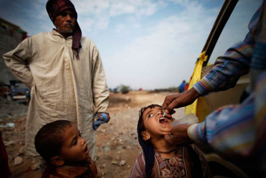 A child is administered polio drops during an antipolio drive in New Delhi on Jan. 15, 2012